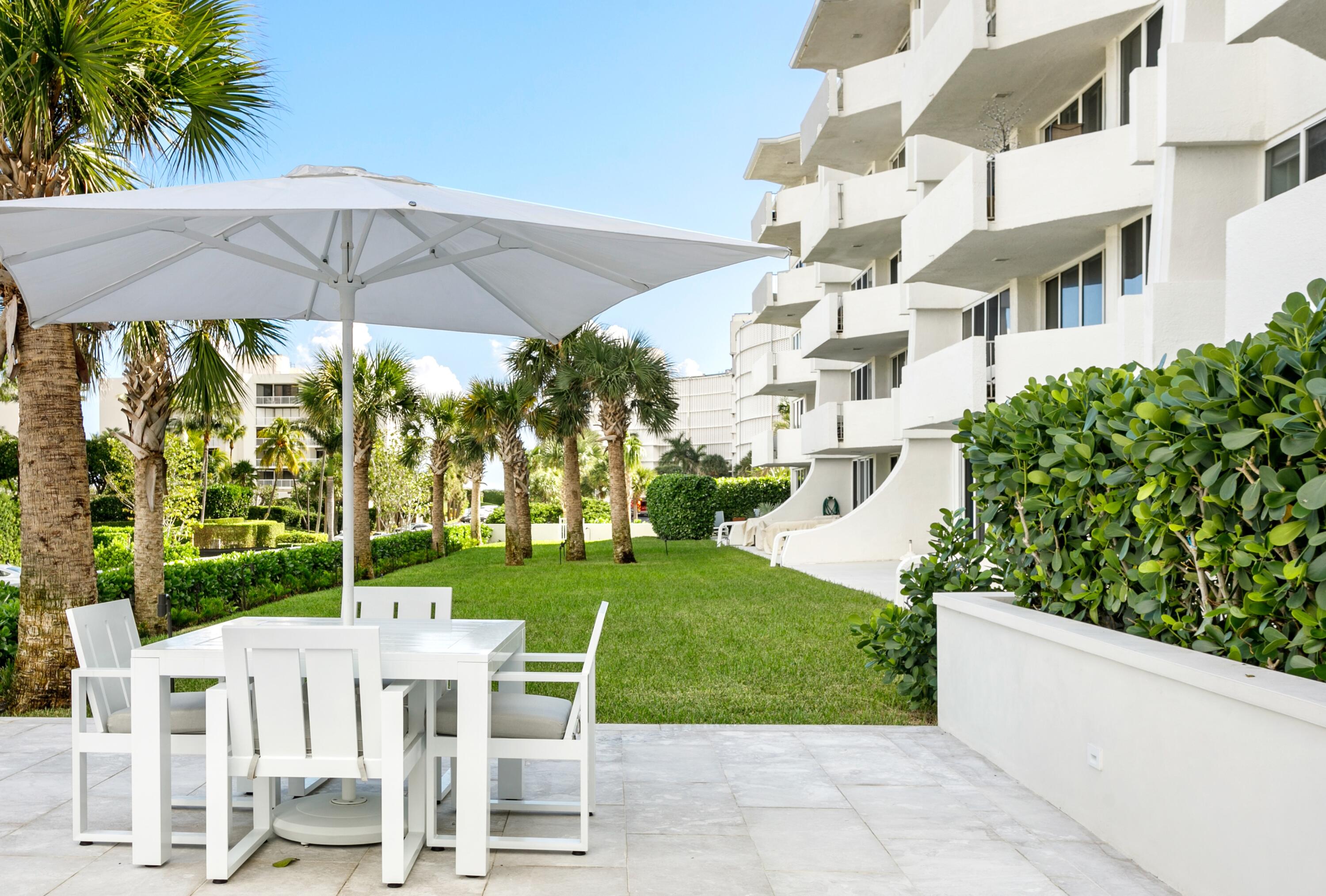 2773 South Ocean Boulevard, Unit 109 Palm Beach, FL 33480 - Photo 22 of 36 a view of an chairs and table in the patio