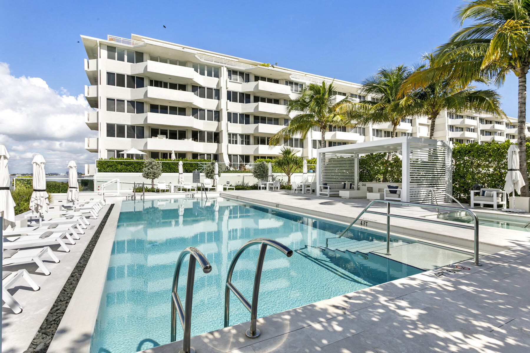 2773 South Ocean Boulevard, Unit 109 Palm Beach, FL 33480 - Photo 26 of 36 a view of swimming pool with outdoor seating and city view