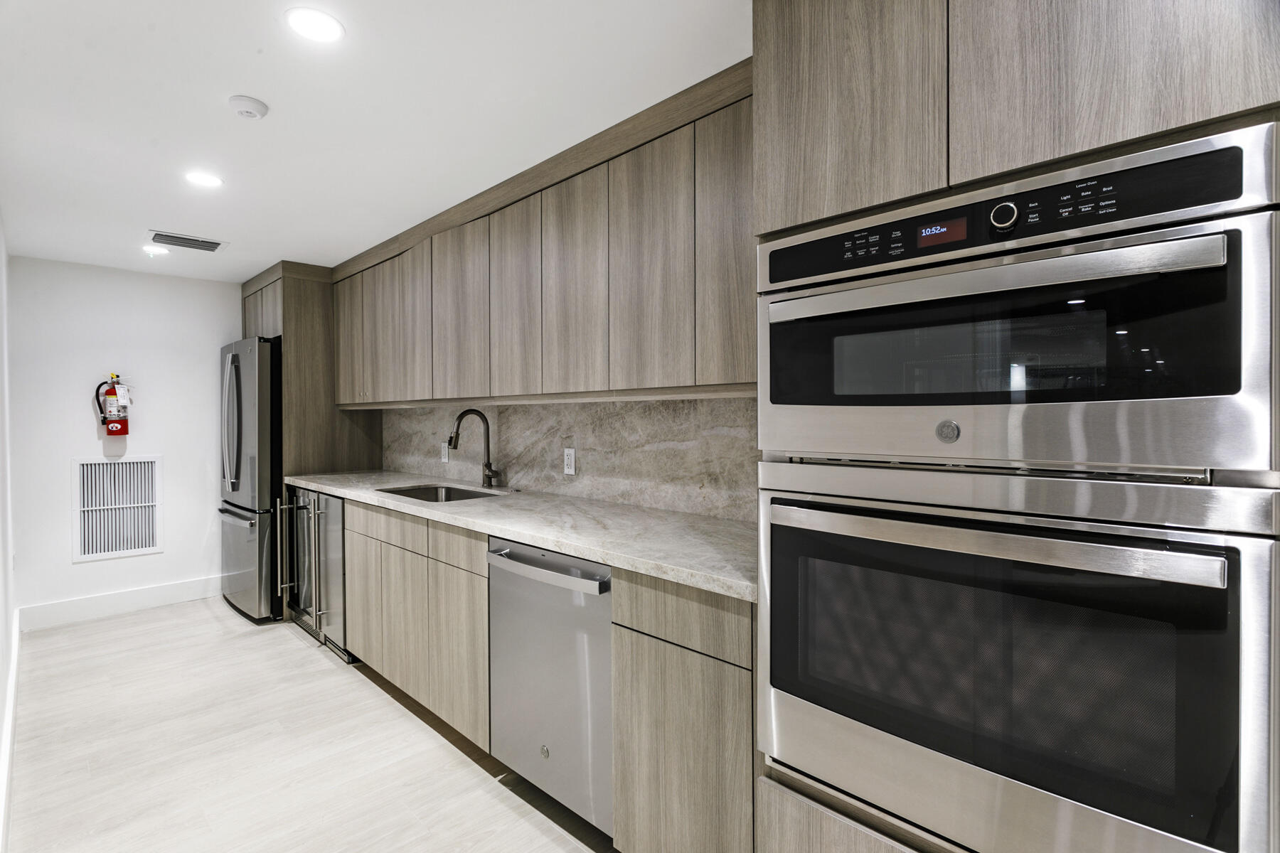 2773 South Ocean Boulevard, Unit 109 Palm Beach, FL 33480 - Photo 30 of 36 a kitchen with stainless steel appliances and cabinets