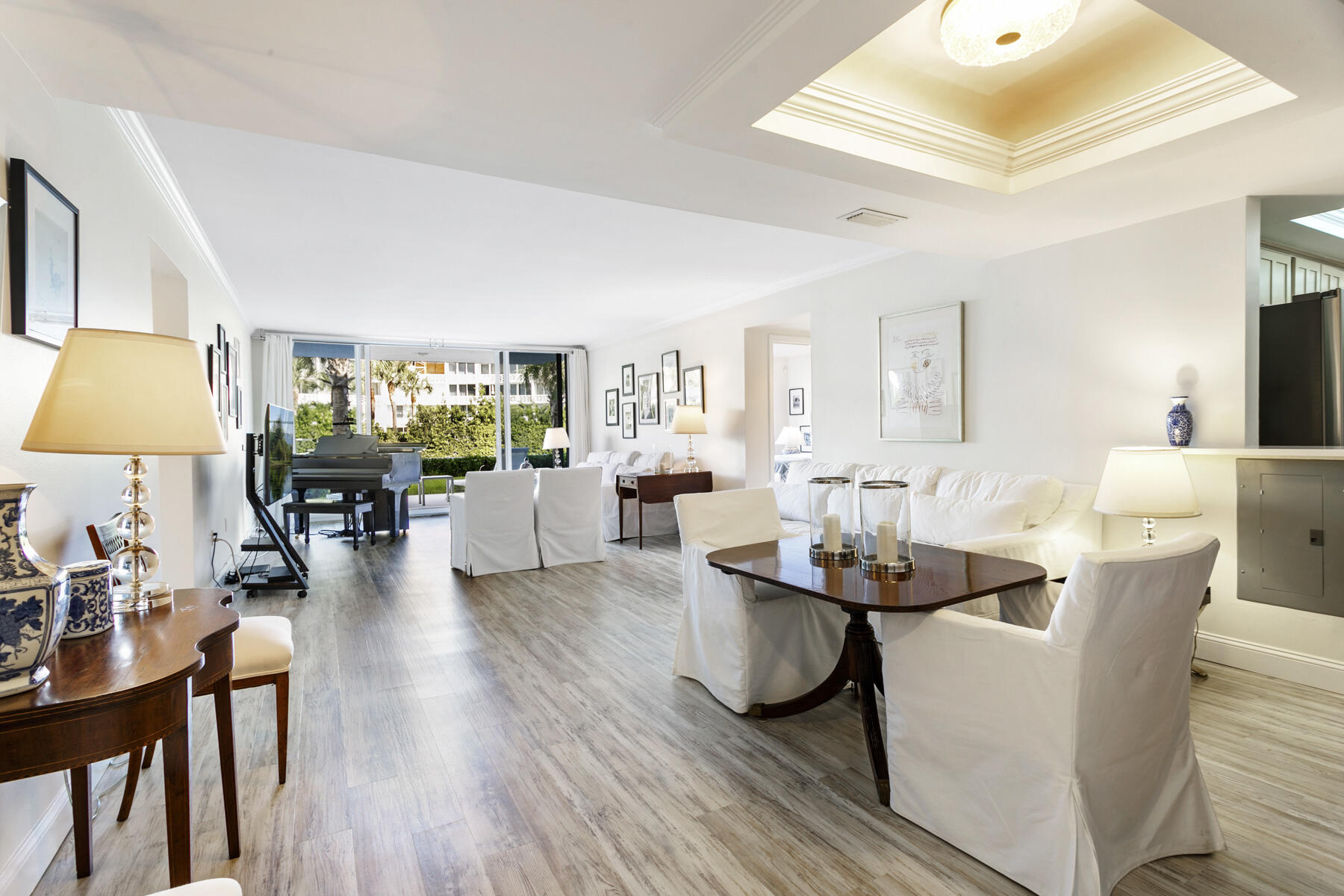 2773 South Ocean Boulevard, Unit 109 Palm Beach, FL 33480 - Photo 3 of 36 a living room with fireplace furniture and a chandelier
