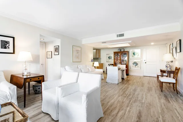 a living room with fireplace furniture and a wooden floor