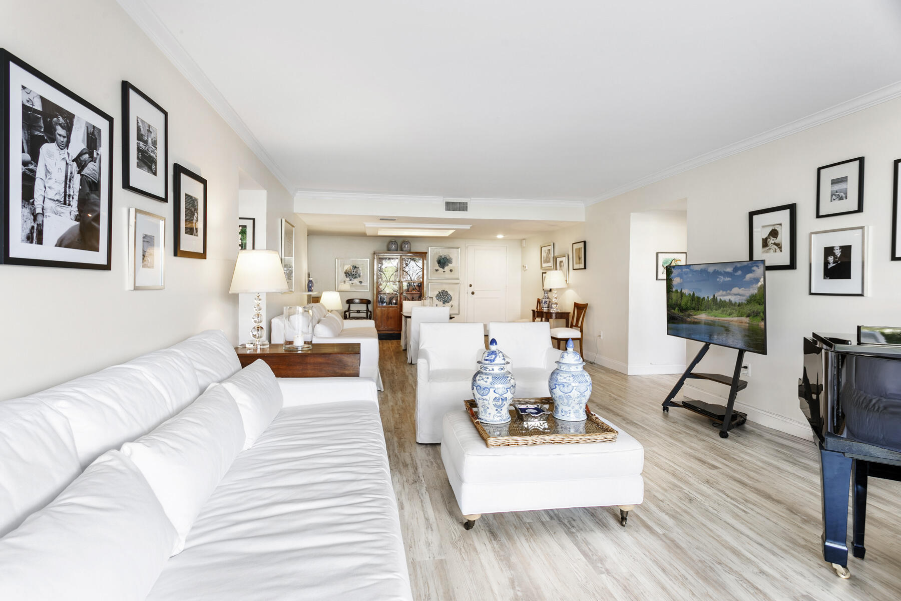 2773 South Ocean Boulevard, Unit 109 Palm Beach, FL 33480 - Photo 8 of 36 a living room with furniture and a wooden floor