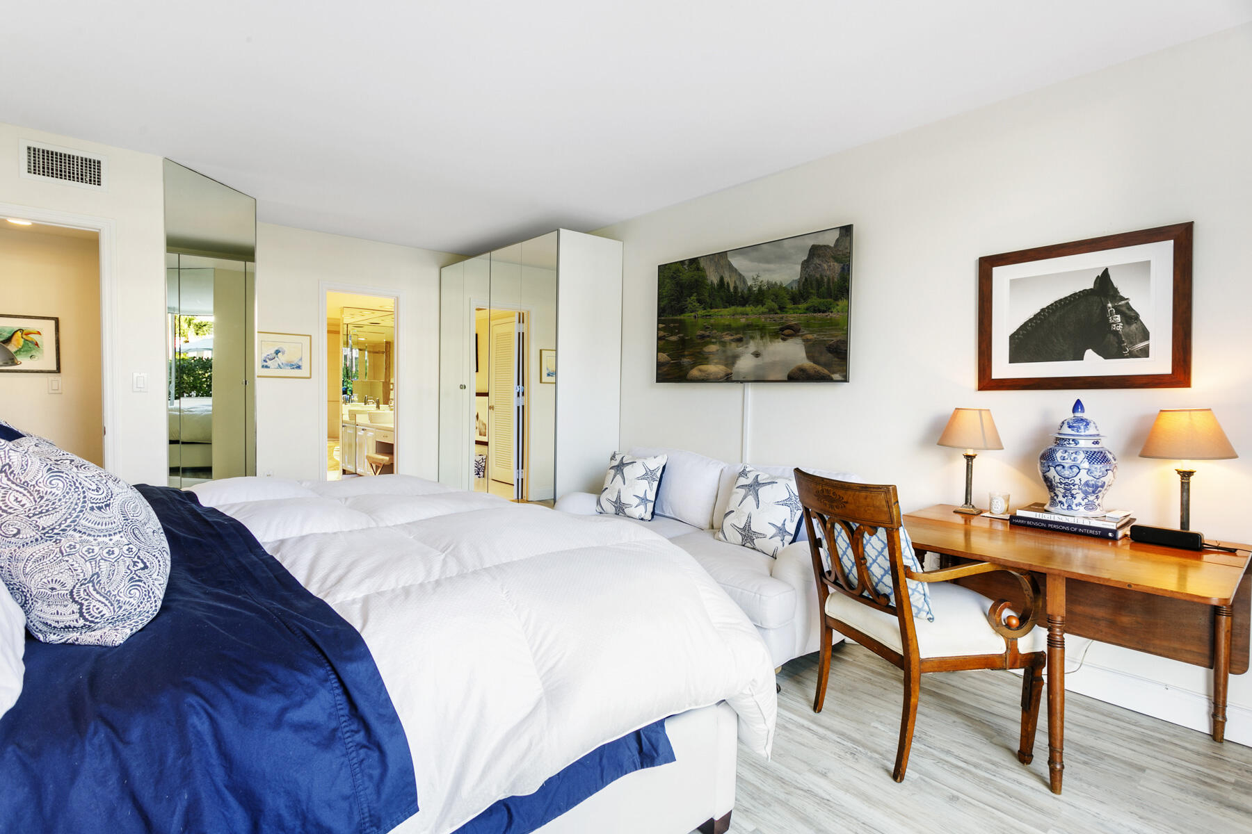 2773 South Ocean Boulevard, Unit 109 Palm Beach, FL 33480 - Photo 10 of 36 a bedroom with a bed and a flat screen tv