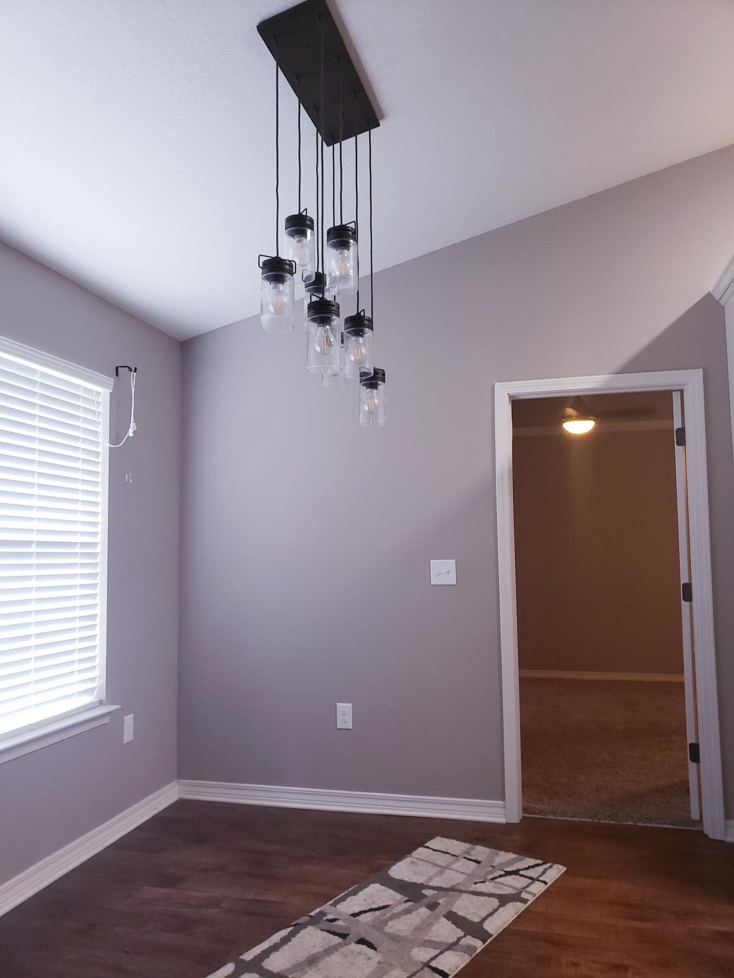 961 Valley Road Crestview, FL 32539 - Photo 2 of 3 a view of room with stairs and wooden floor