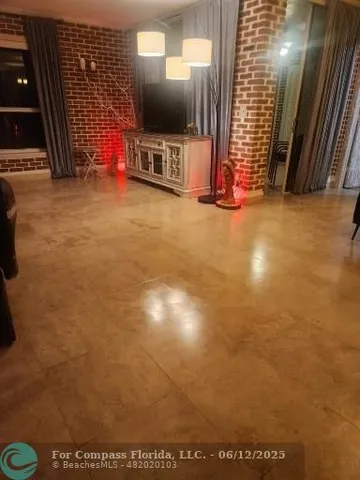 a view of a lobby with wooden floor