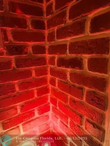 a view of a house with a flower garden