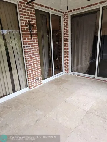 a view of a balcony with wooden fence