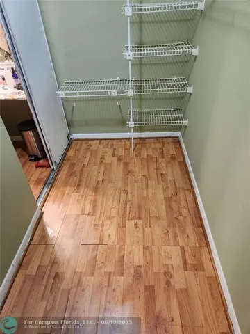 a white toilet sitting next to a bath tub and shower