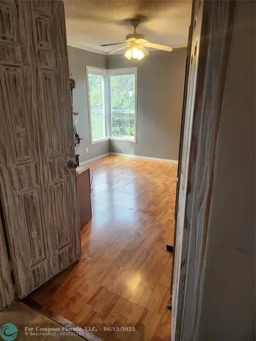 a kitchen with granite countertop a stove and a refrigerator