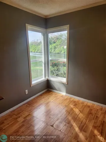 a kitchen with a sink a counter space and a window