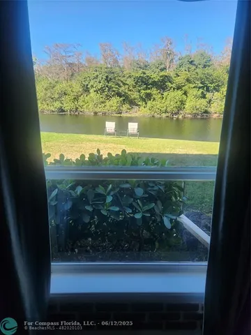 a view of livingroom with furniture and a window