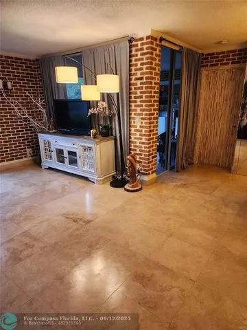 a view of a workspace with furniture