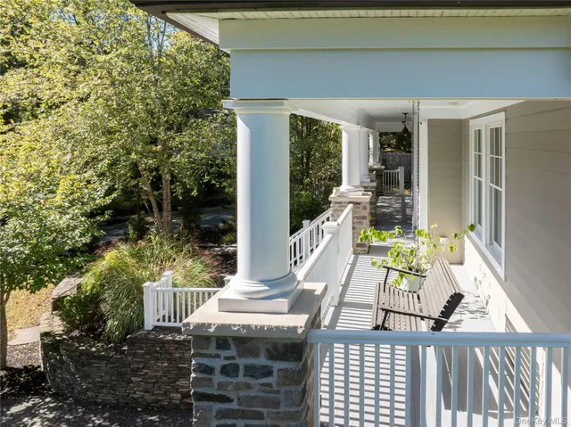 a view of balcony with furniture