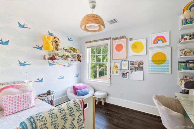 a living room filled with furniture and a window