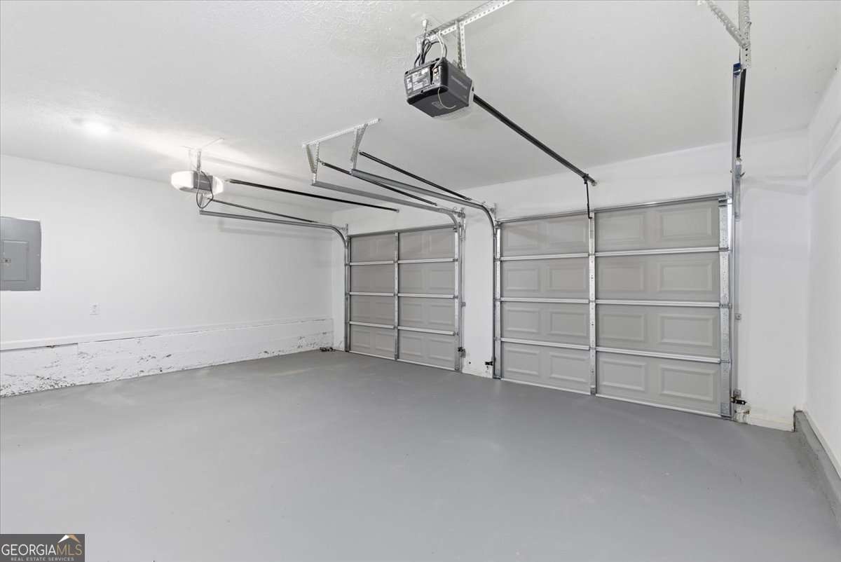 4634 Noah Valley Acworth, GA 30101 - Photo 23 of 27 an empty room with white walls and empty racks