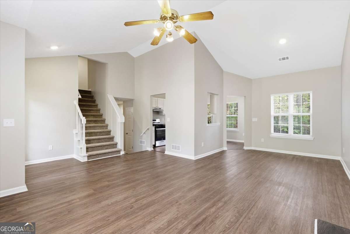 4634 Noah Valley Acworth, GA 30101 - Photo 5 of 27 a view of an empty room with wooden floor and a window