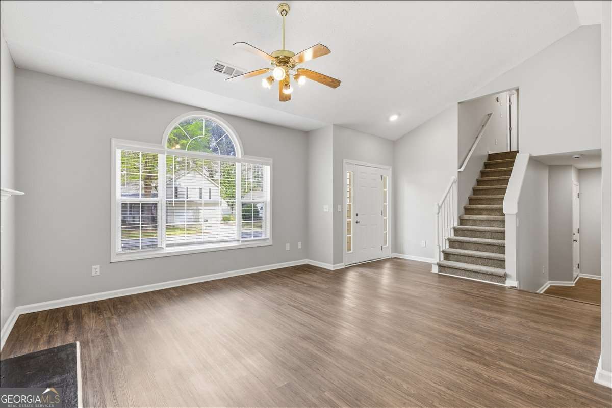4634 Noah Valley Acworth, GA 30101 - Photo 6 of 27 an empty room with wooden floor and windows