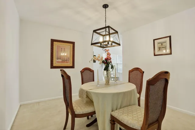 a kitchen with granite countertop a sink a stove and cabinets