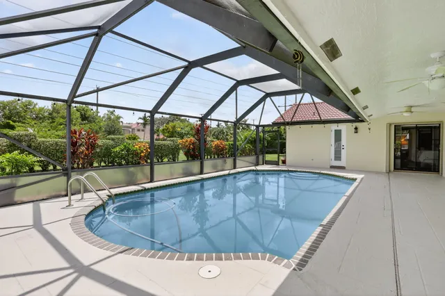 a kitchen with stainless steel appliances a stove a sink and white cabinets