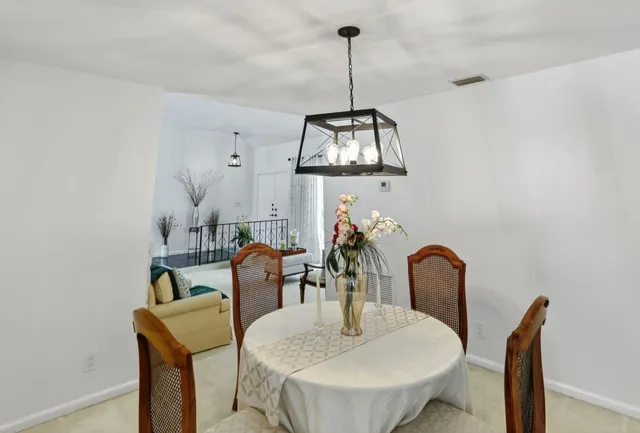 a kitchen with stainless steel appliances granite countertop a refrigerator and a stove