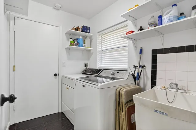 a kitchen with stainless steel appliances white cabinets and a stove