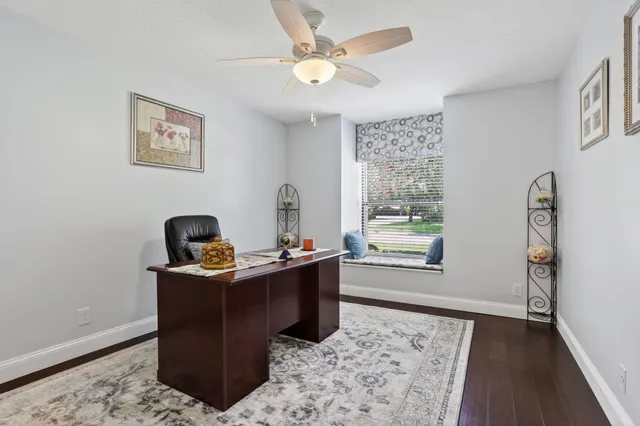 a bathroom with a double vanity sink mirror and chandelier