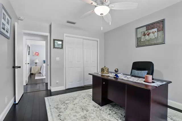 a bathroom with a tub a sink and a window