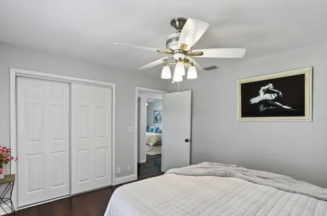 an aerial view of a house with yard and green space