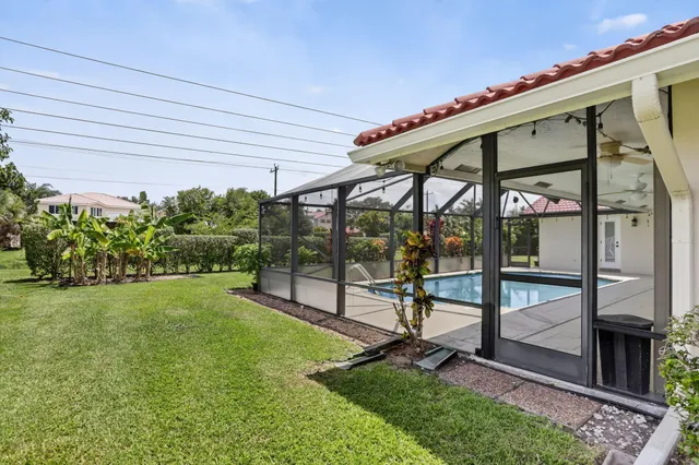 a front view of house with yard and outdoor seating