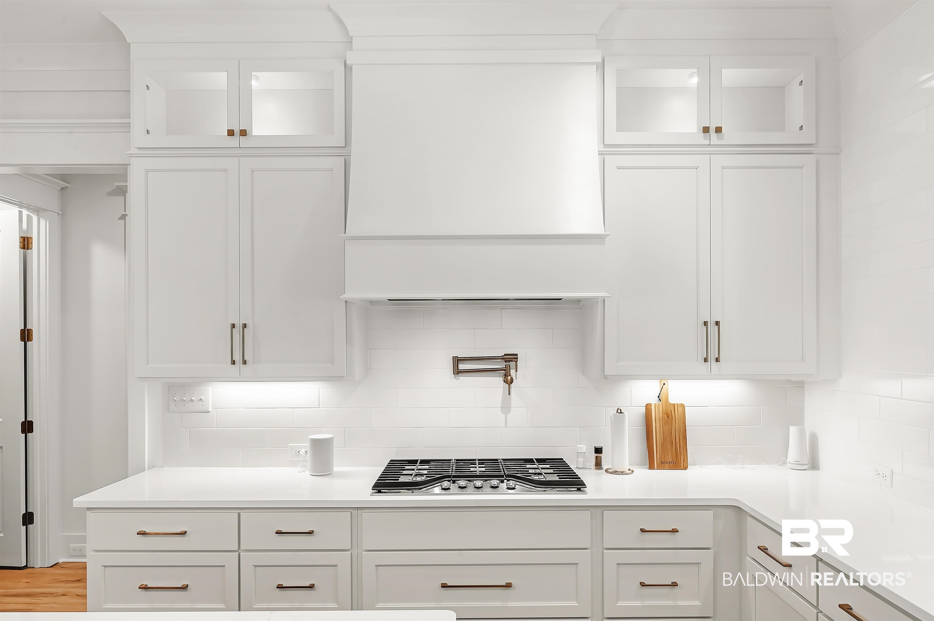 27888 Oakachoy Loop Daphne, AL 36526 - Photo 10 of 65 Kitchen with white cabinetry and stainless steel gas cooktop
