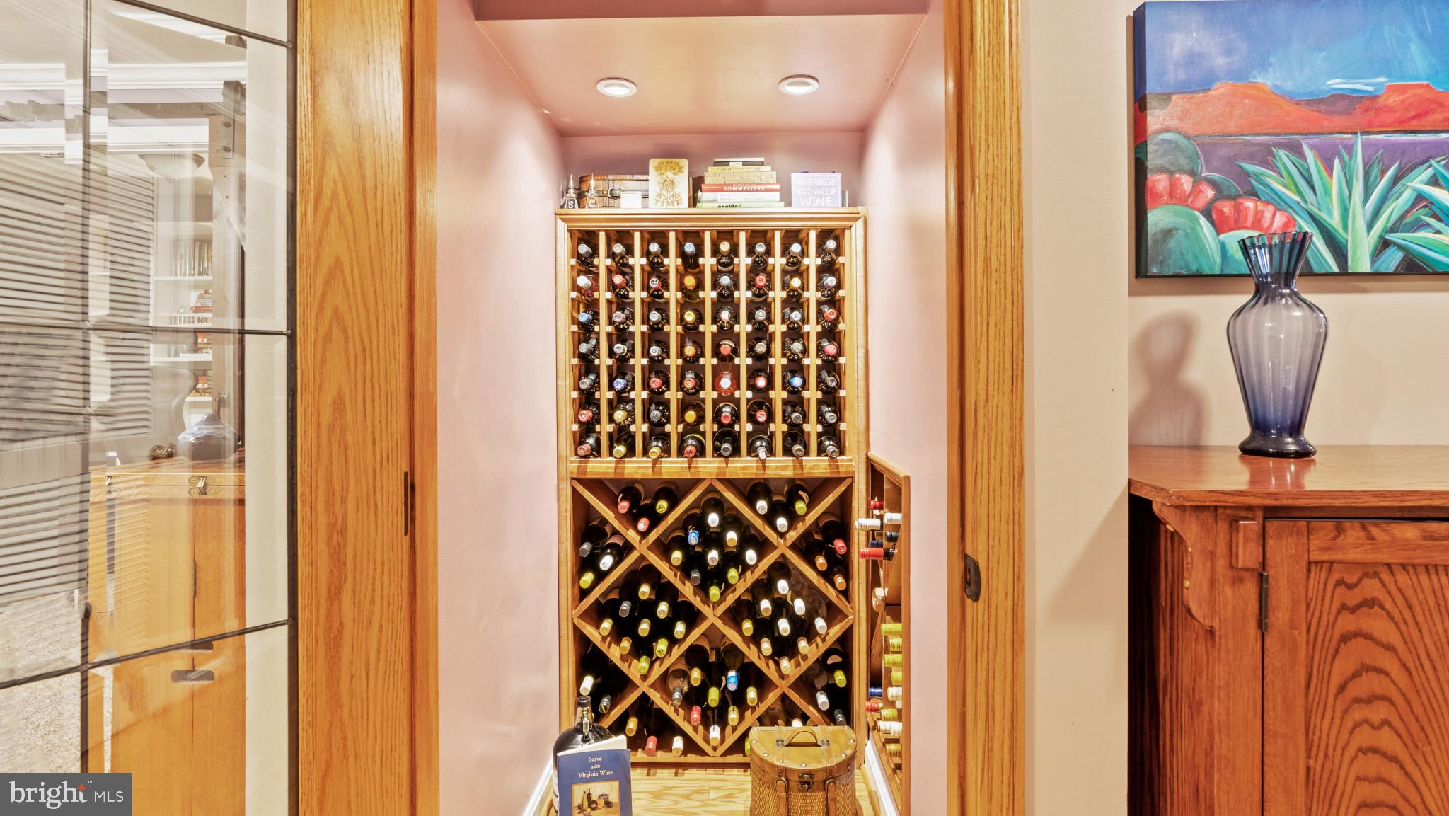 12083 Edgemere Circle Reston, VA 20190 - Photo 25 of 32 The best use for under the stairs! wine storage.