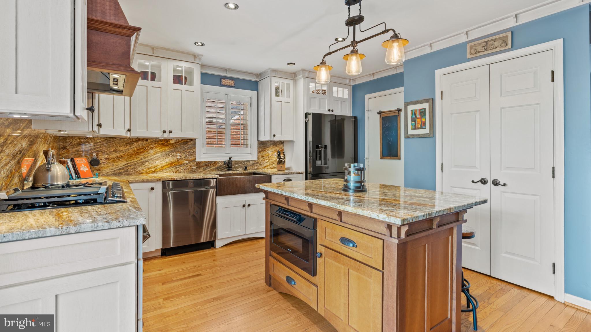 12083 Edgemere Circle Reston, VA 20190 - Photo 9 of 32 hand hammered copper sink, glazed cabinetry.