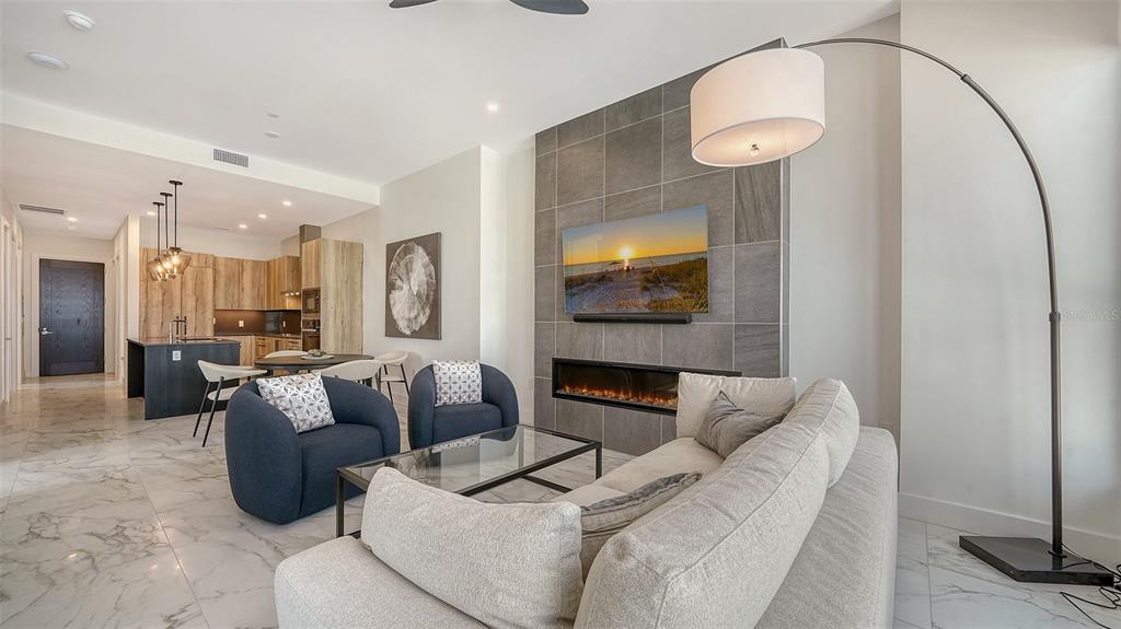 33 South Palm Avenue, Unit 804 Sarasota, FL 34236 - Photo 12 of 42 a living room with furniture and a flat screen tv