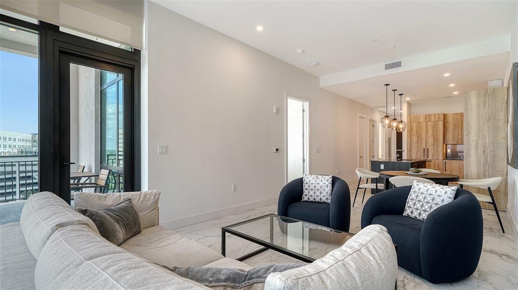33 South Palm Avenue, Unit 804 Sarasota, FL 34236 - Photo 13 of 42 a living room with furniture and a large window