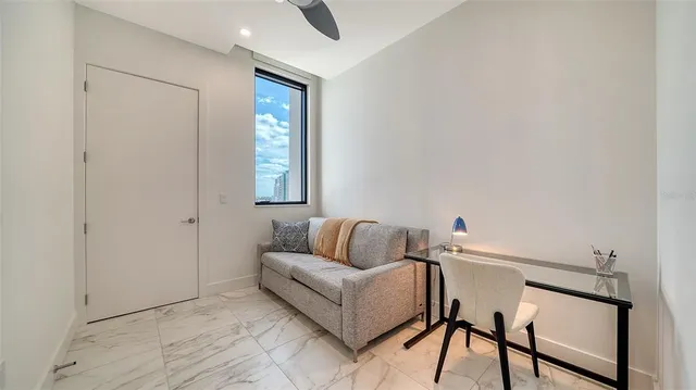 a living room with furniture and a window