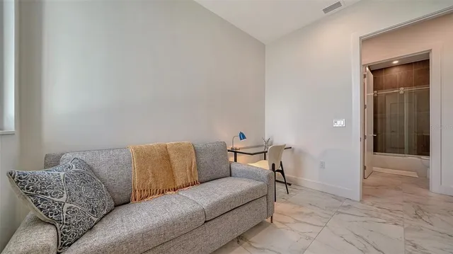 a living room with furniture and a couch