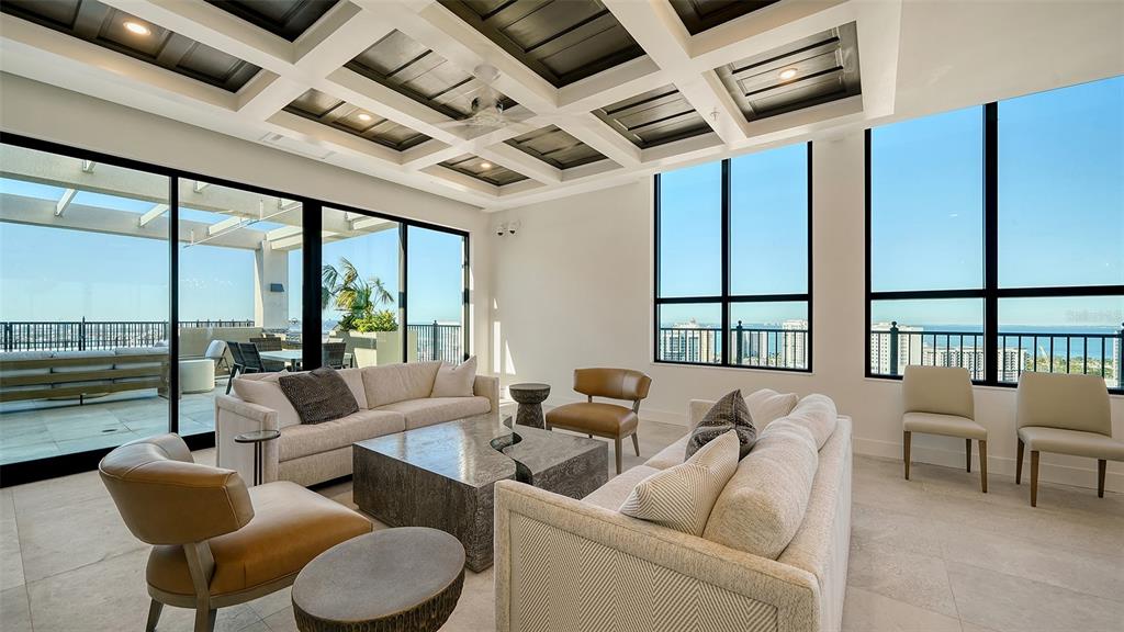 33 South Palm Avenue, Unit 804 Sarasota, FL 34236 - Photo 41 of 42 a living room with furniture and floor to ceiling windows