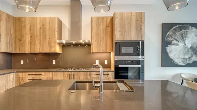 a view of kitchen with furniture and flat screen tv