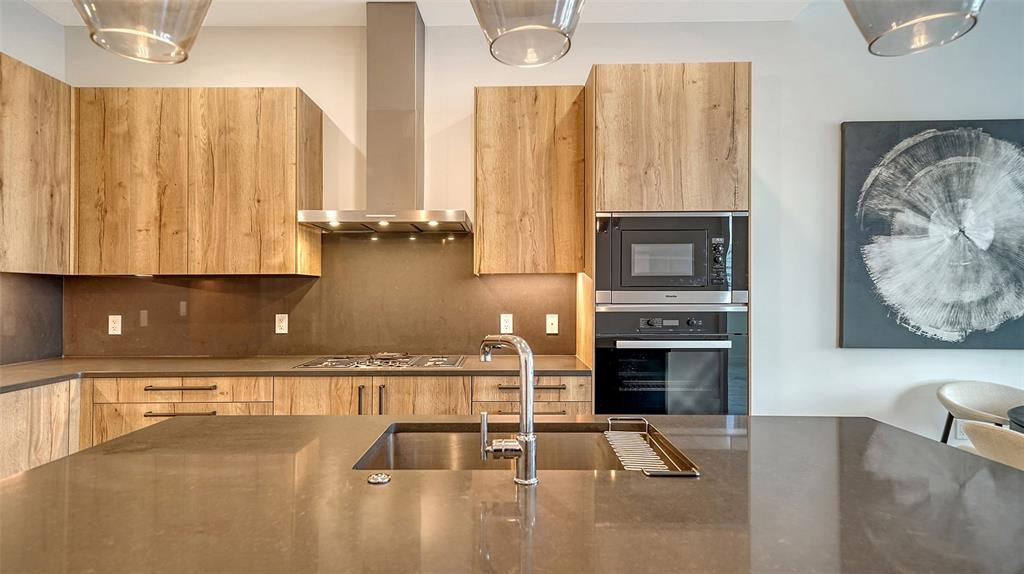 33 South Palm Avenue, Unit 804 Sarasota, FL 34236 - Photo 6 of 42 a view of kitchen with furniture and flat screen tv