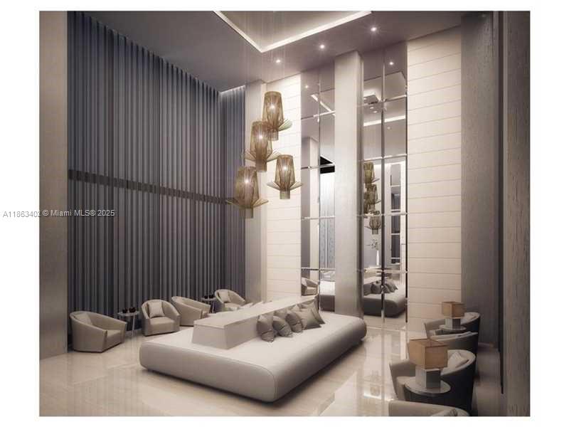 1010 Southwest 2nd Avenue, Unit 1110 Miami, FL 33130 - Photo 16 of 18 a living room with furniture and a potted plant