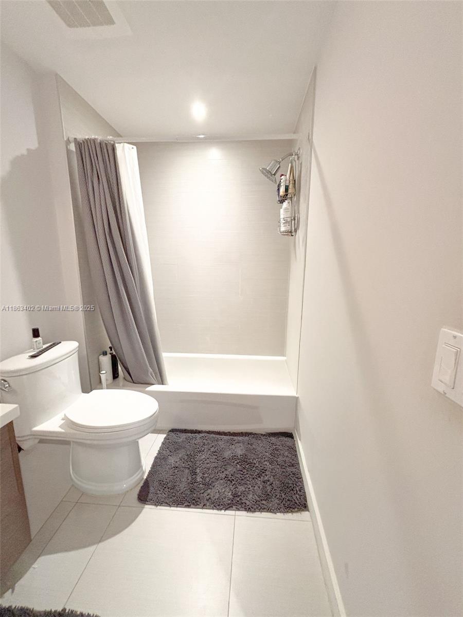 1010 Southwest 2nd Avenue, Unit 1110 Miami, FL 33130 - Photo 18 of 18 a bathroom with a toilet and a shower