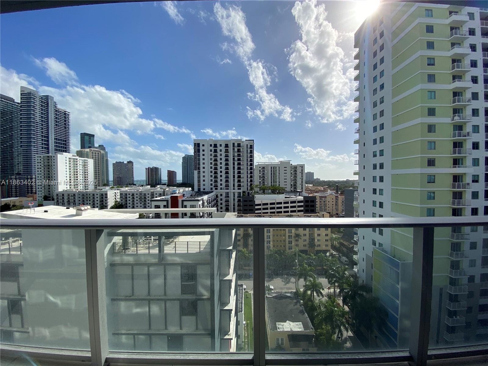 1010 Southwest 2nd Avenue, Unit 1110 Miami, FL 33130 - Photo 2 of 18 a large white building with a view of city