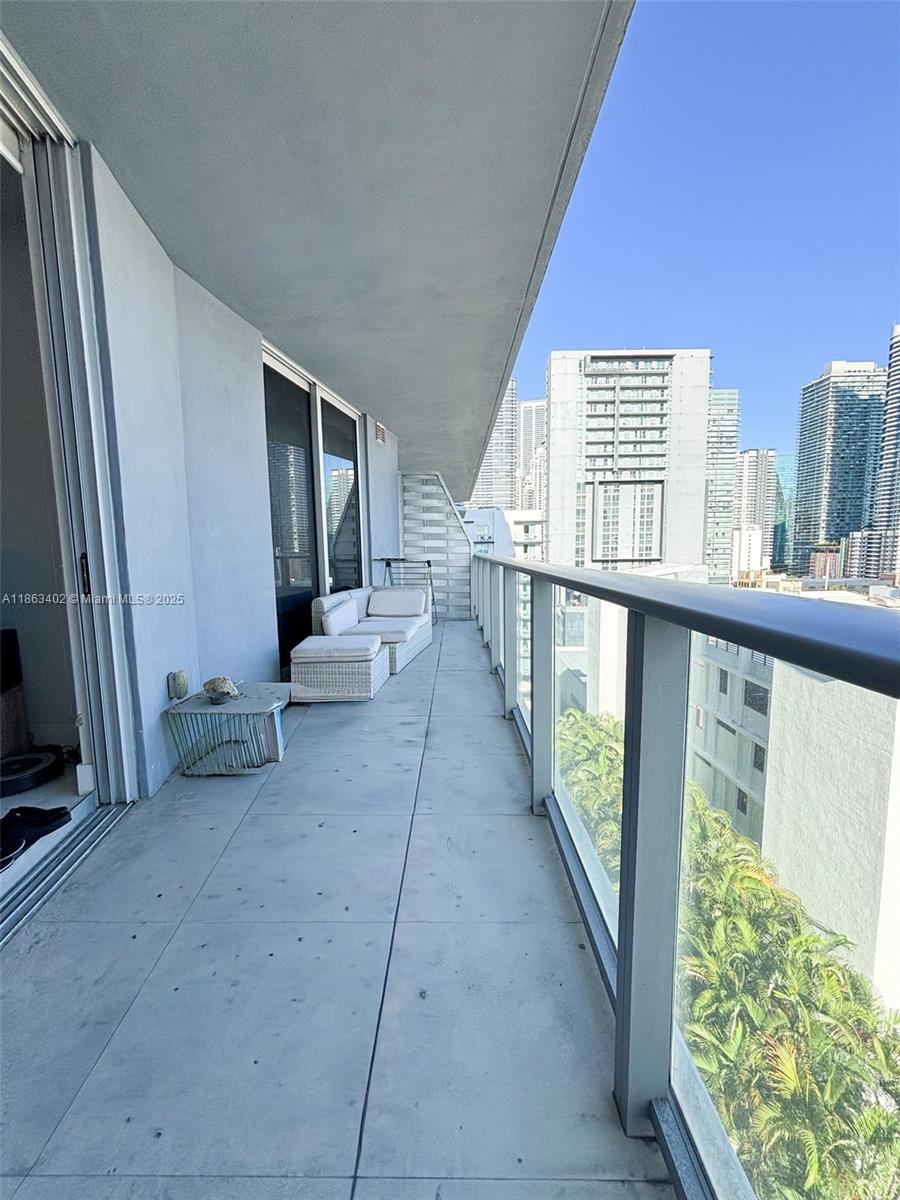 1010 Southwest 2nd Avenue, Unit 1110 Miami, FL 33130 - Photo 4 of 18 a view of balcony with couch