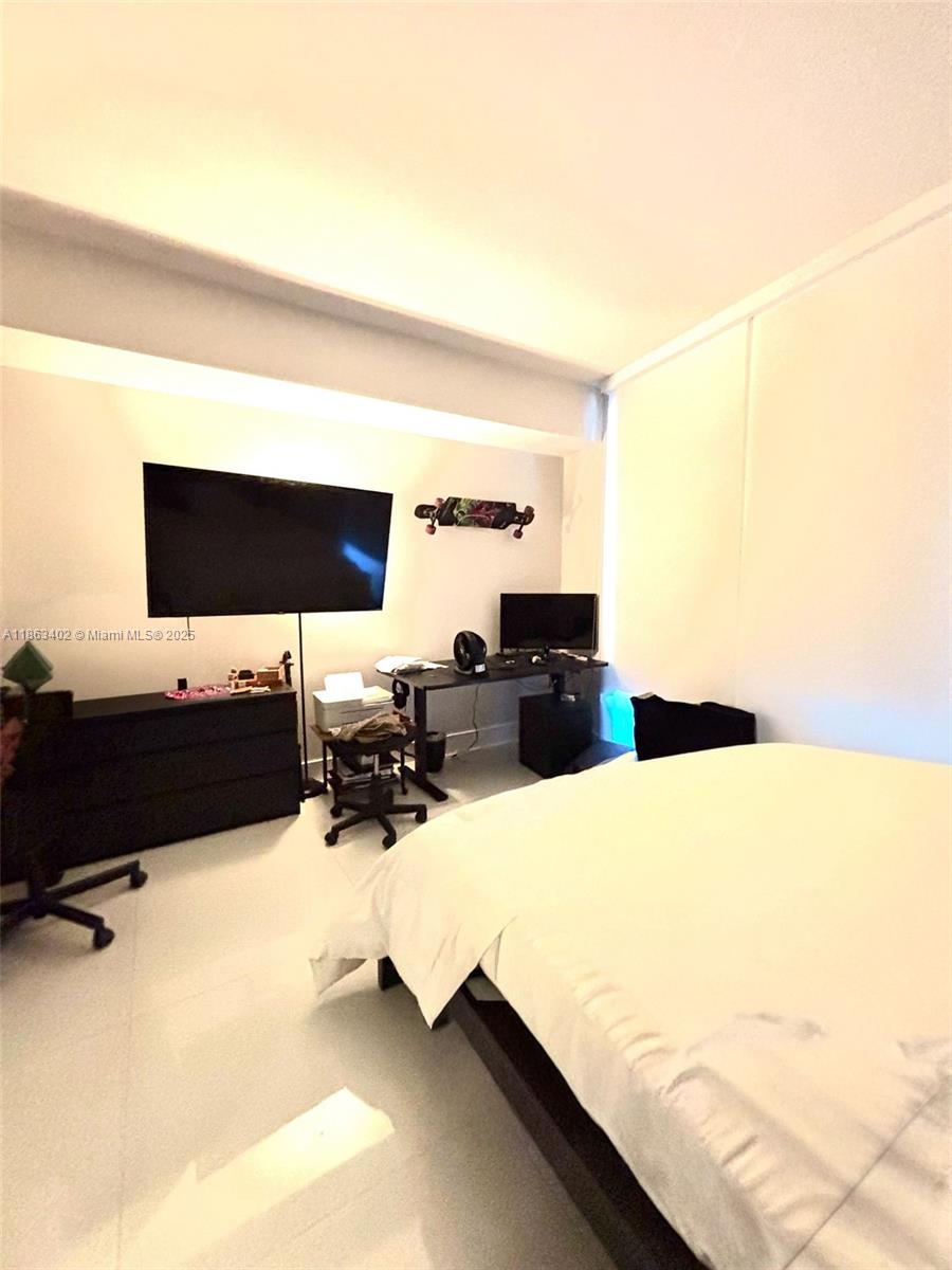 1010 Southwest 2nd Avenue, Unit 1110 Miami, FL 33130 - Photo 9 of 18 a living room with furniture and a flat screen tv