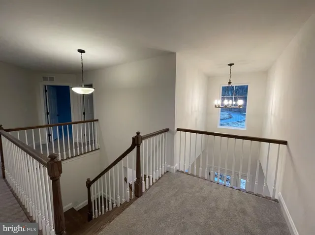 a view of a hallway with windows