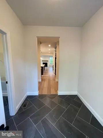 a view of an empty room with stairs