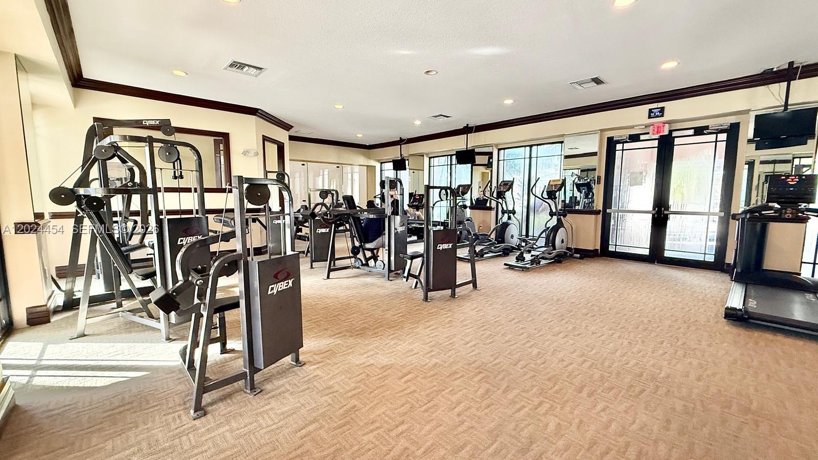 2727 Anzio Court, Unit 106 Palm Beach Gardens, FL 33410 - Photo 32 of 43 a view of a room with gym equipment