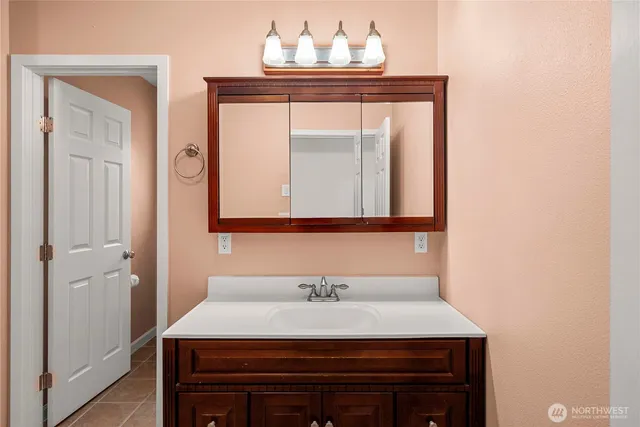 a bathroom with a sink and a mirror