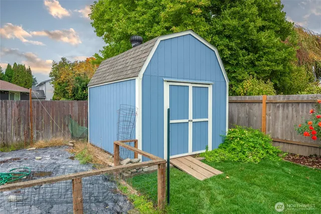 a backyard of a house with green landscape