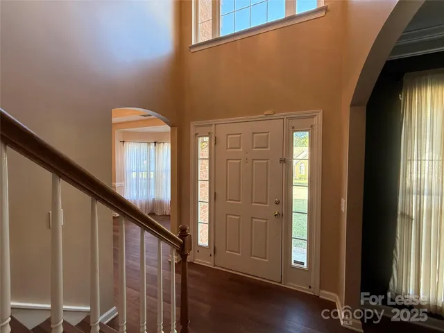 a view of front door with wooden floor